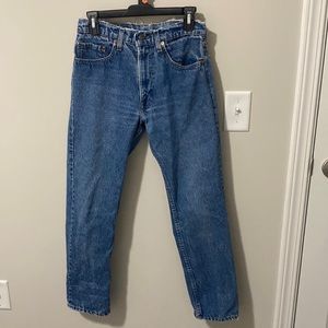 Distressed blue, high rise Levi jeans